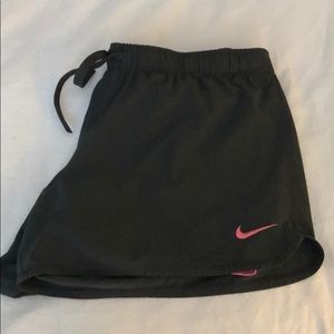 Nike shorts with pink spandex underneath